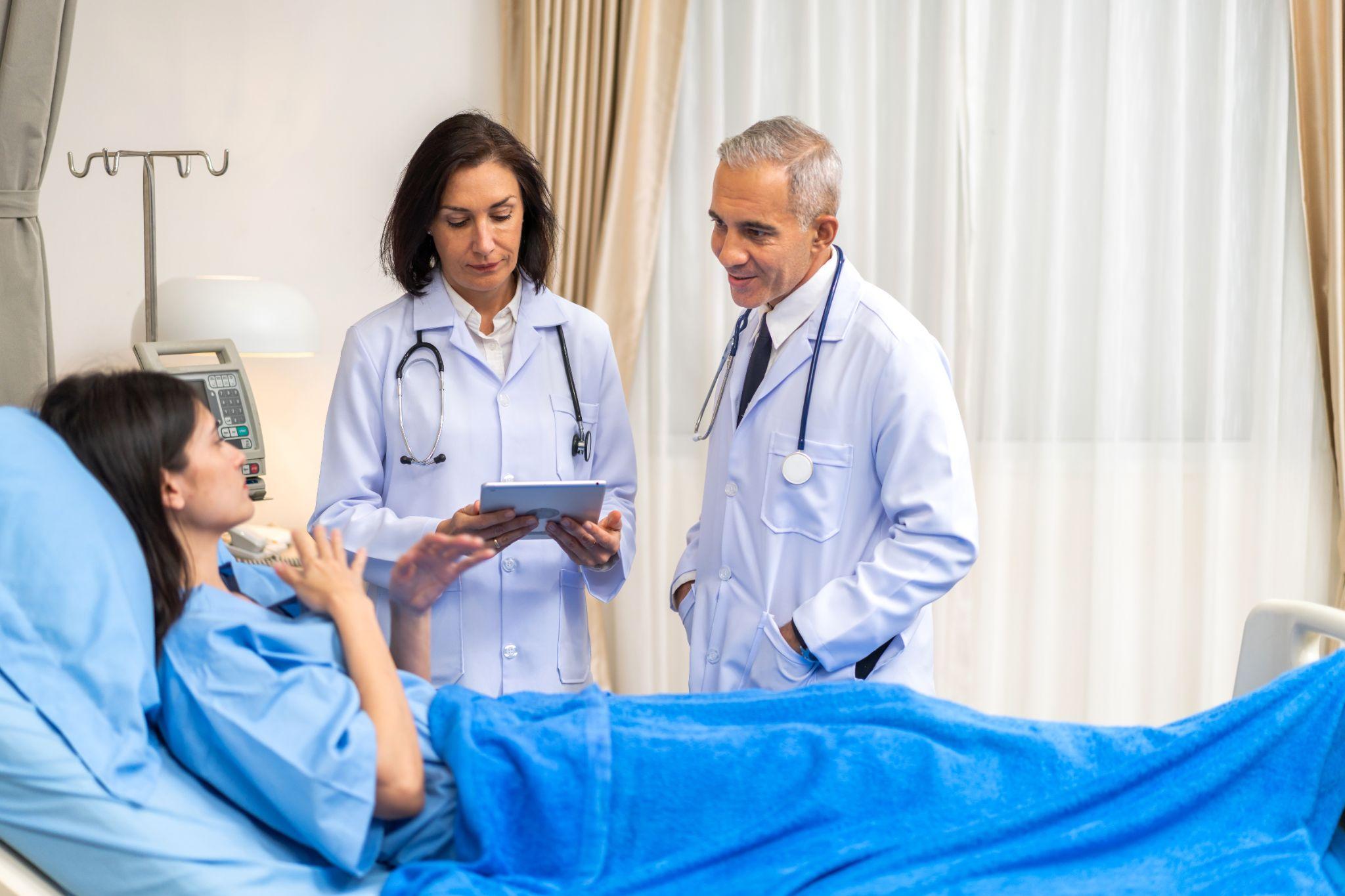 Bilingual healthcare staff communicating with a patient